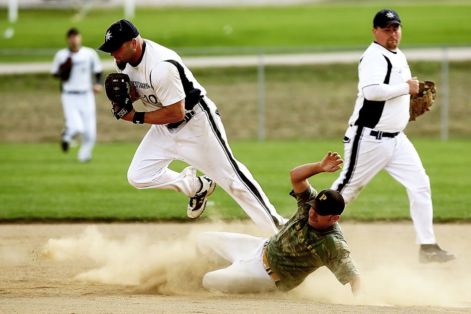 Dynamic baseball scene capturing players in action with a dramatic slide on the field.